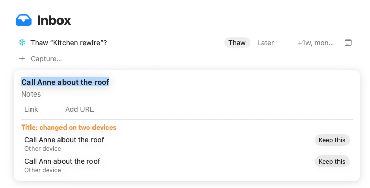 A sync conflict on the Mac: the title was changed on two devices, and both versions are kept